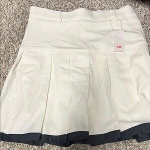 White Pleated Skirt with Black Trim